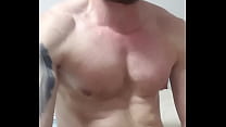 fitness guy is masturbate at the bed in home